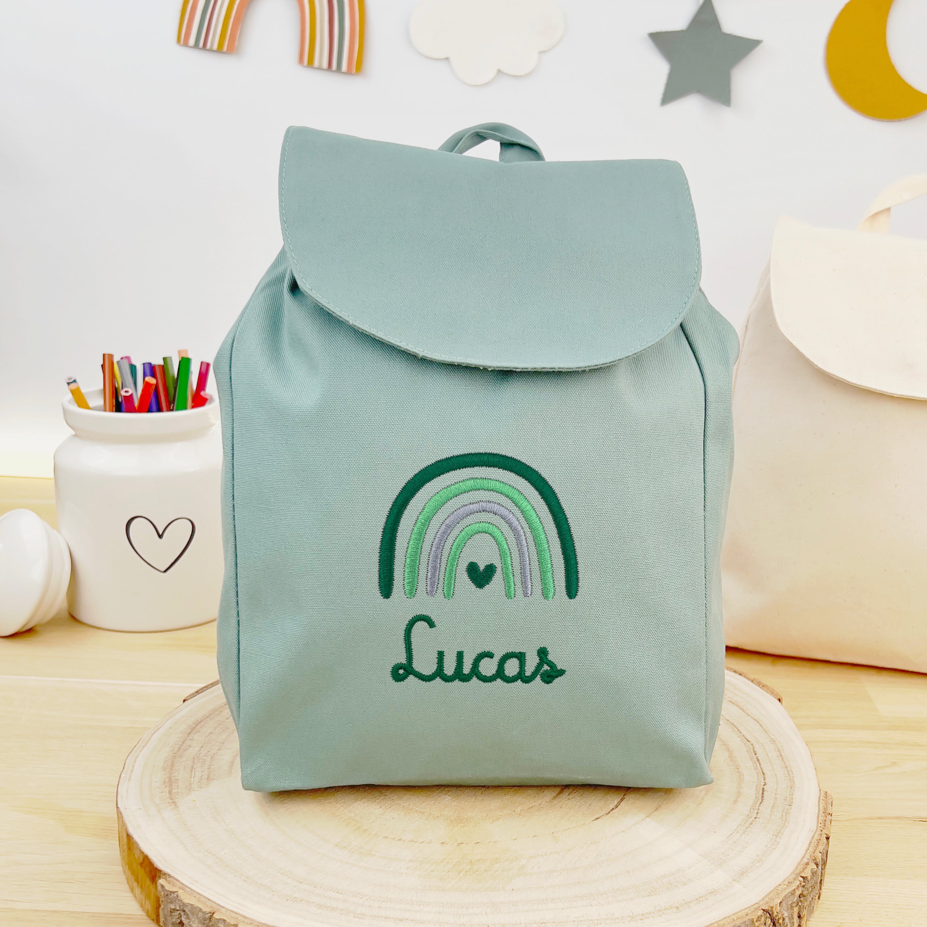 Bio Kinderrucksack mit Namen und Regenbogen - Mint/Grün